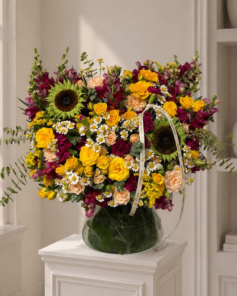 هلیا گلدان شیشه‌ای گل‌های آفتابی